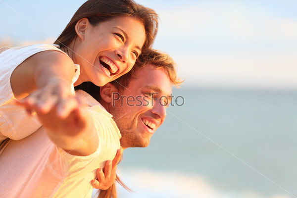 Couple laughing in love on travel