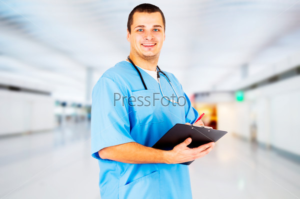 Male Doctor stands in the hall of the hospital