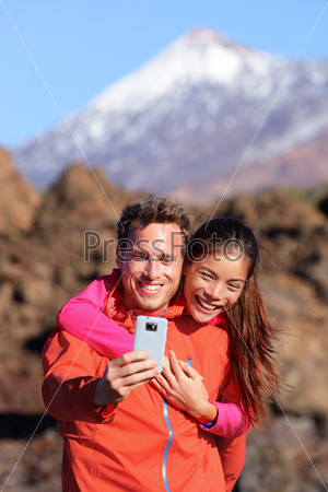 Selfie couple hiking in beautiful nature
