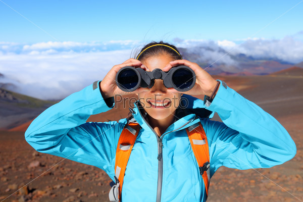 Hiker looking in binoculars