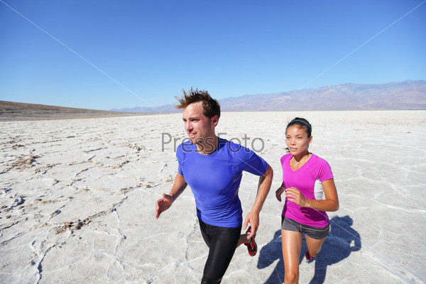 Trail running marathon athletes outdoors in desert