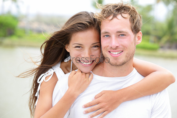 Young couple smiling happy portrait - interracial couple