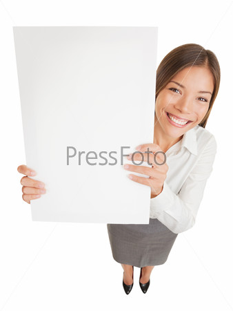 Poster sign woman holding up blank placard sign for your attention showing copyspace for advert or text. Fun high angle view of a happy young smiling professional woman isolated on white background