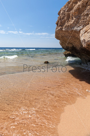 Panorama of the beach at reef, Sharm el Sheikh, Egypt. beach and cliffs overhanging the water