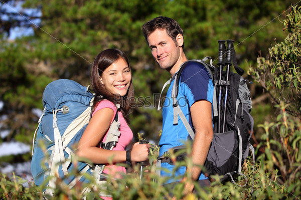 Happy hiking friends / couple hikers in forest