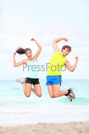 Fitness couple jumping fun