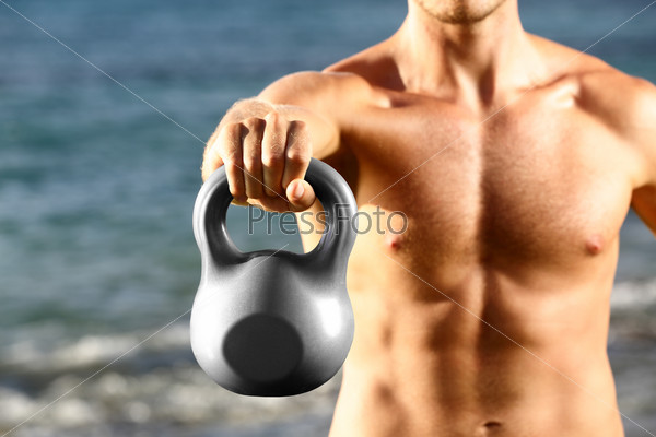 Crossfit fitness man training with kettlebell