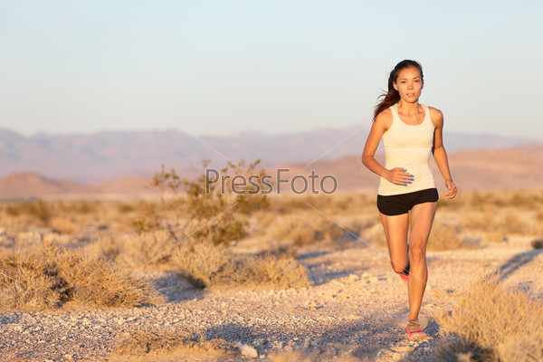 Woman runner running cross country trail run