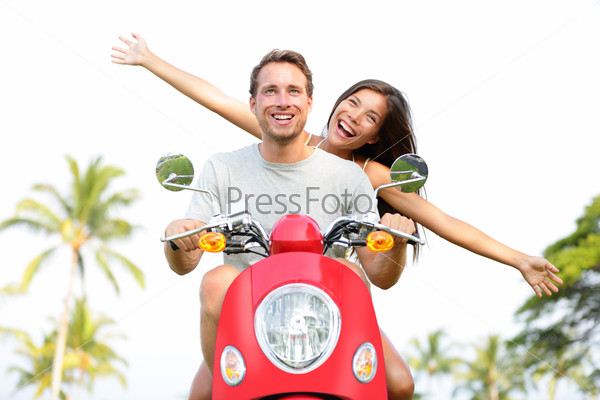 Happy free freedom couple driving scooter