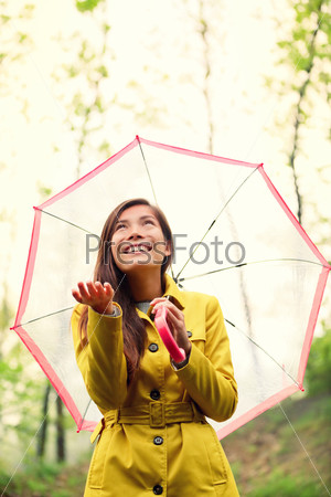 Asian Autumn woman happy after rain under umbrella