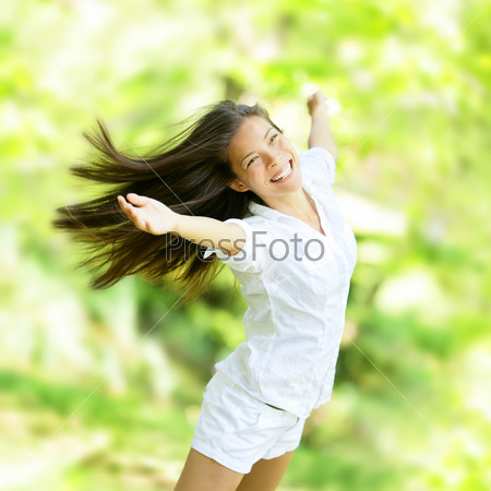 Rejoicing happy woman in flying motion