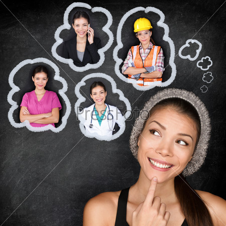 Career choice options - student thinking of future education. Young Asian woman contemplating career options smiling looking up at thought bubbles on a blackboard with images of different professions