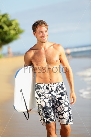 Man on beach holding body surfing bodyboard