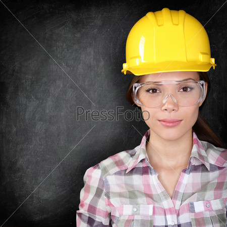 Construction worker woman on blackboard texture