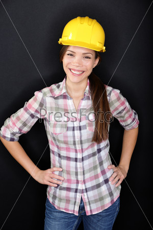 Construction worker or engineer portrait on black