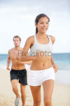Running couple - woman fitness runner happy