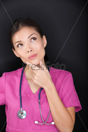 Doctor / medical female nurse thinking looking up