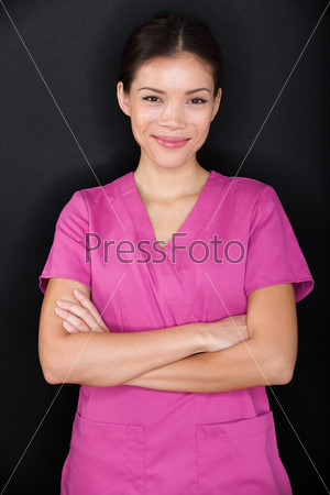 Female nurse portrait happy confident and pink