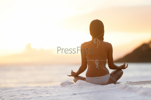 Meditation - Yoga woman meditating at beach sunset