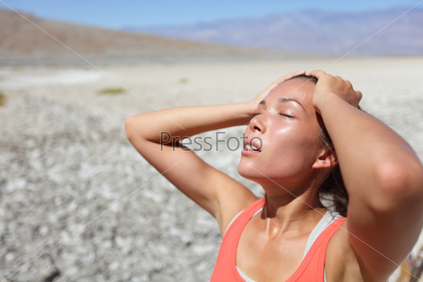 Desert Woman Thirsty Dehydrated In Death Valley. Dehydration, Overheating, Thirst And Heat Stroke Concept Image With Girl In Desert Nature.