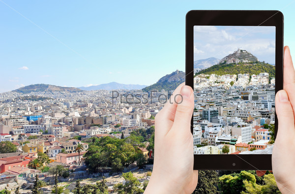 travel concept - tourist taking photo of Athens cityscape on mobile gadget, Greece