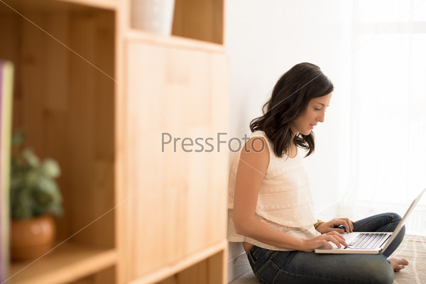 Woman busy surfing the net at home