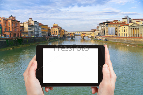 travel concept - tourist photograph Ponte Vecchio on Arno River in Florence city, Italy in sunny evening on tablet pc with cut out screen with blank place for advertising logo