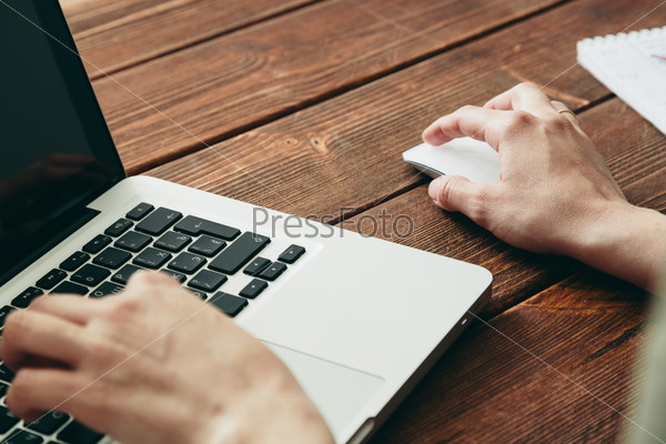 Woman work on laptop on old wooden desk