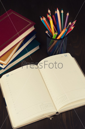 diary, books and pencils. Copy space. Education supplies