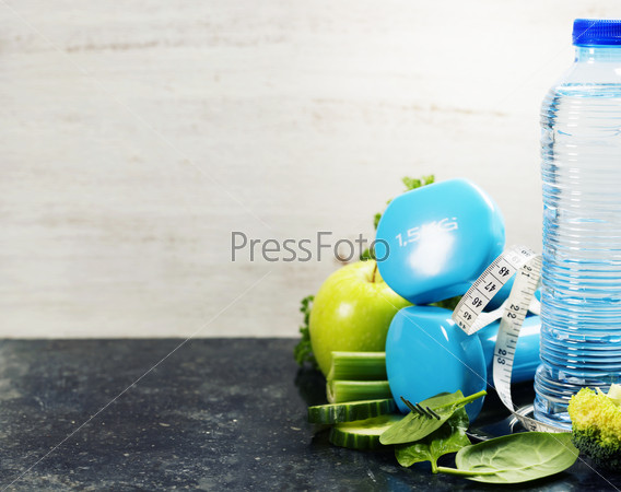 Fresh healthy vegetables, water and measuring tape. Health, sport and diet concept, stock photo