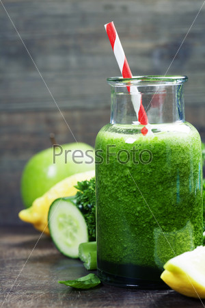 Fresh organic green smoothie - detox, diet and healthy food concept