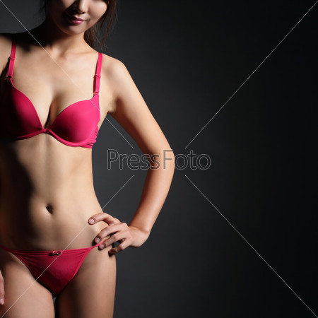 Attractive Sexy woman with beautiful body posing and wear red underwear isolated on gray background, asian beauty