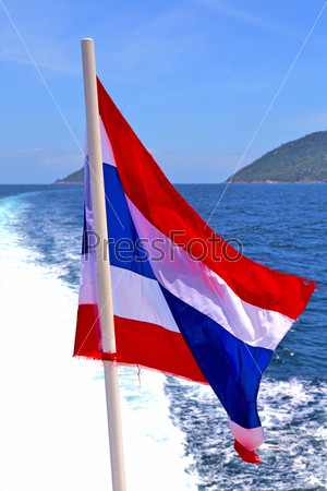 asia  kho samu bay isle waving flag    in thailand and south china sea
