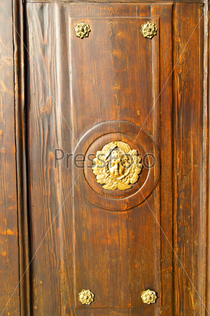gold face house door in italy