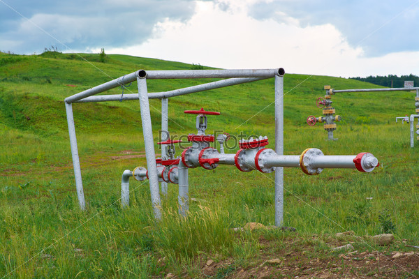 Valves on the pipeline at the mouth of the oil well