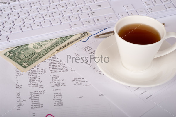 White keyboard with coffee cup, dollars and documents, stock photo