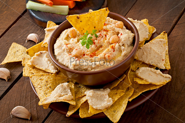 Healthy homemade  hummus with olive oil and pita chips