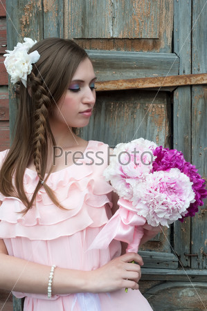 Beautiful sad woman with flower...