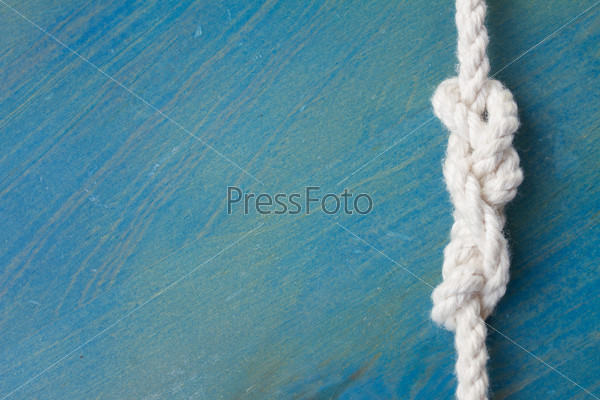 marine knot on blue wood  with copy space