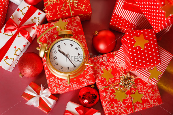 Christmas: big red gift box with red alarm clock - last minute christmas shopping