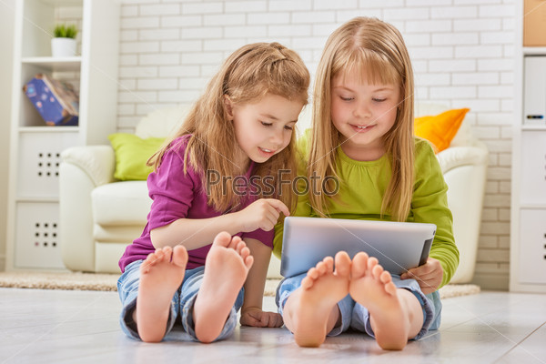 happy children holding digital tablet