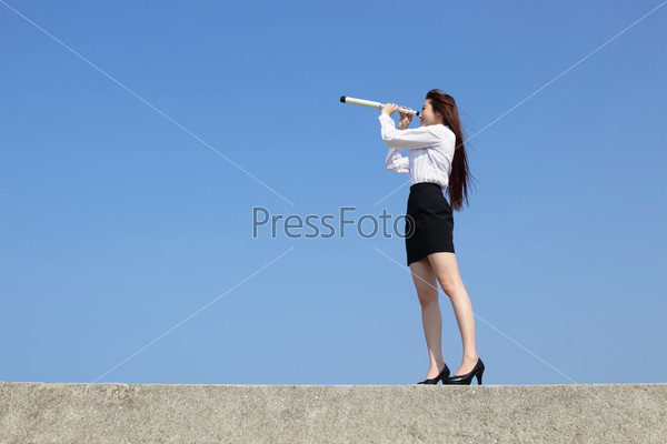 Business woman with telescope ( spyglass ) looking forward Prospects for future business with blue sky background, asian beauty