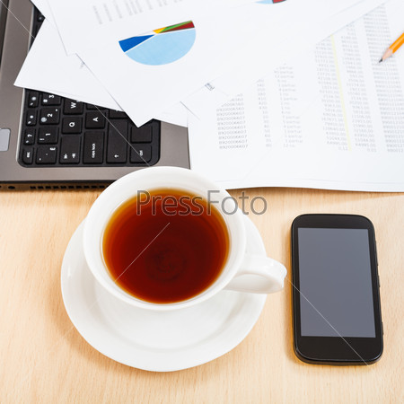business workflow - top view cup of tea and office tools on table