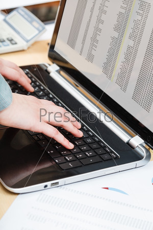 business workflow - businessman working with laptop at office desk