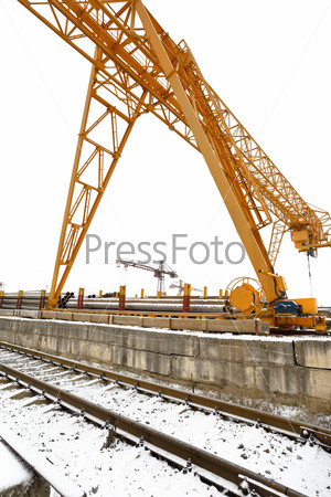 gantry cranes over railroad in metal pipe outdoor warehouse