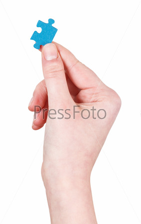 female hand hold jigsaw puzzle piece isolated on white background