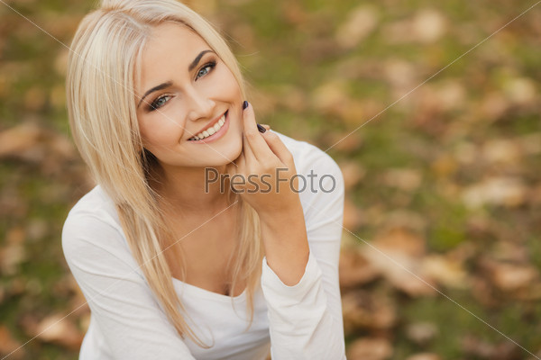 Close Up Portrait Of Young Blonde Beautiful Woman In Warm Autumn Scarf. Ourdoors.