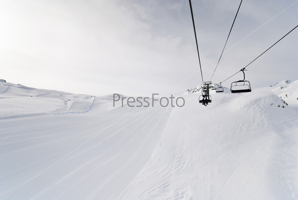 ski run and ski lift on snow slopes of mountains in Paradiski region, Val d\'Isere - Tignes , France