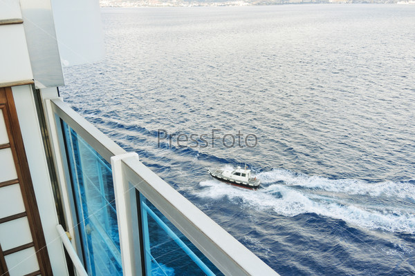 Boat with pilot approaching to cruise ship in Strait of Messina, Italy, stock photo
