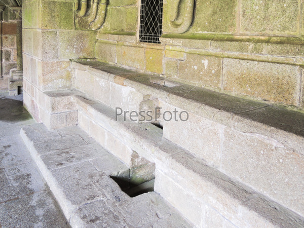 MONT SAINT-MICHEL, FRANCE - AUGUST 9, 2014: stone seats in abbey Mont Saint Michel. The abbey has been protected as a French monument historique from 1862